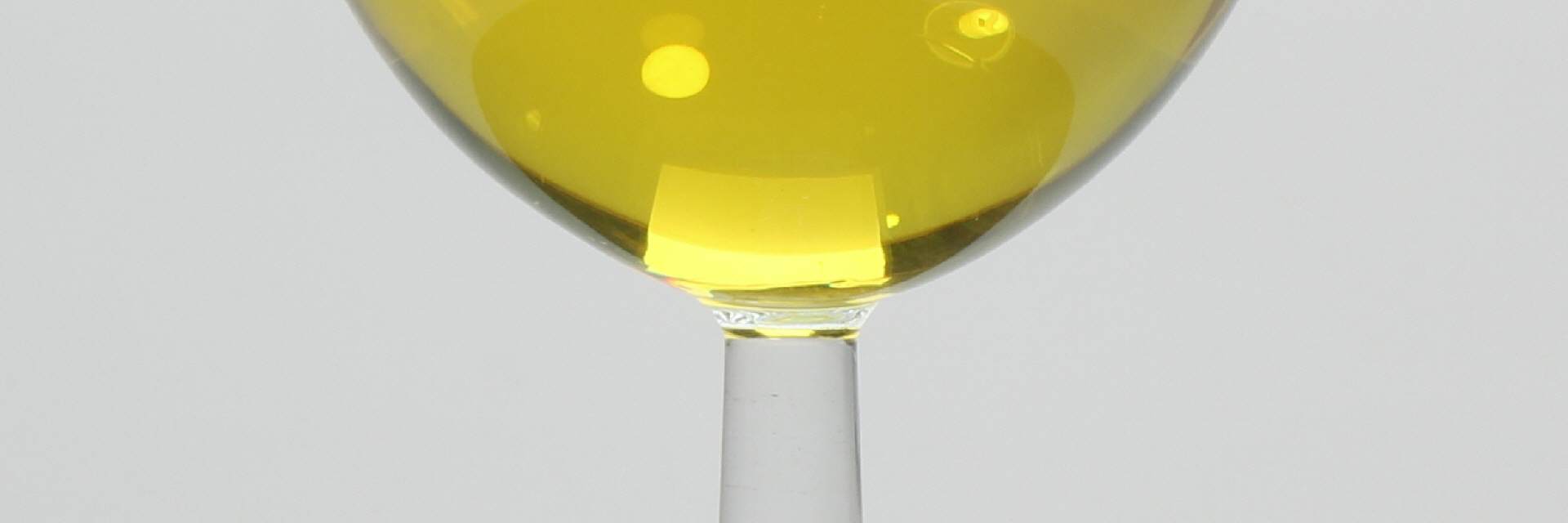 Yellow Golden Colloidal Silver 25ppm in a wine glas